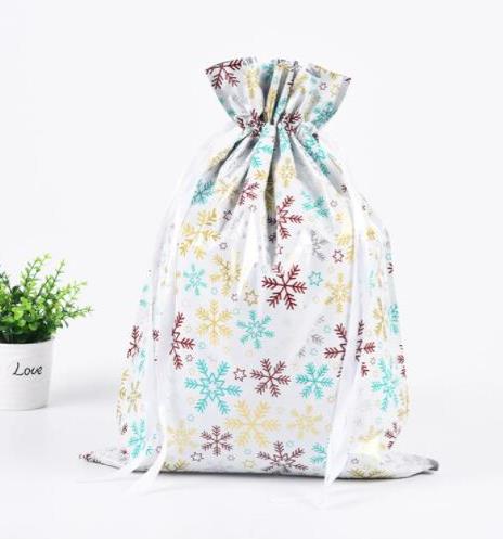 Kép valamiből Karácsonyi ajándékcsomagoló táska madzaggal - 51x39 cm - hópehelyek