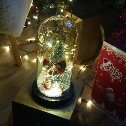 Kép valamiből Világító karácsonyfa üveg vázában, ajándékcsomagolásban