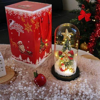 Kép valamiből Világító karácsonyfa üveg vázában, ajándékcsomagolásban